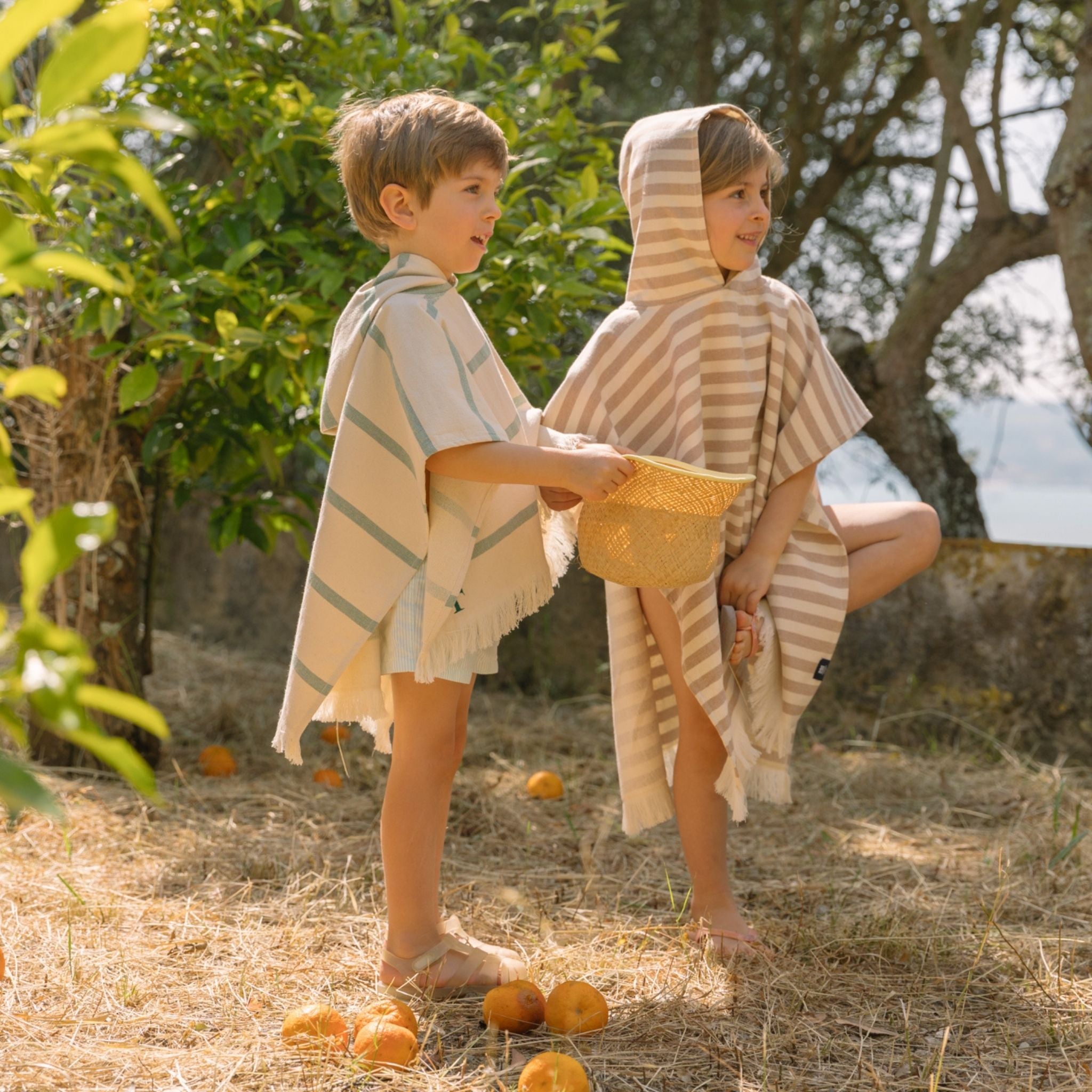 torres-novas-beach-barra-horizontal-stripes-kid-poncho-beige-lifestyle-4.jpg