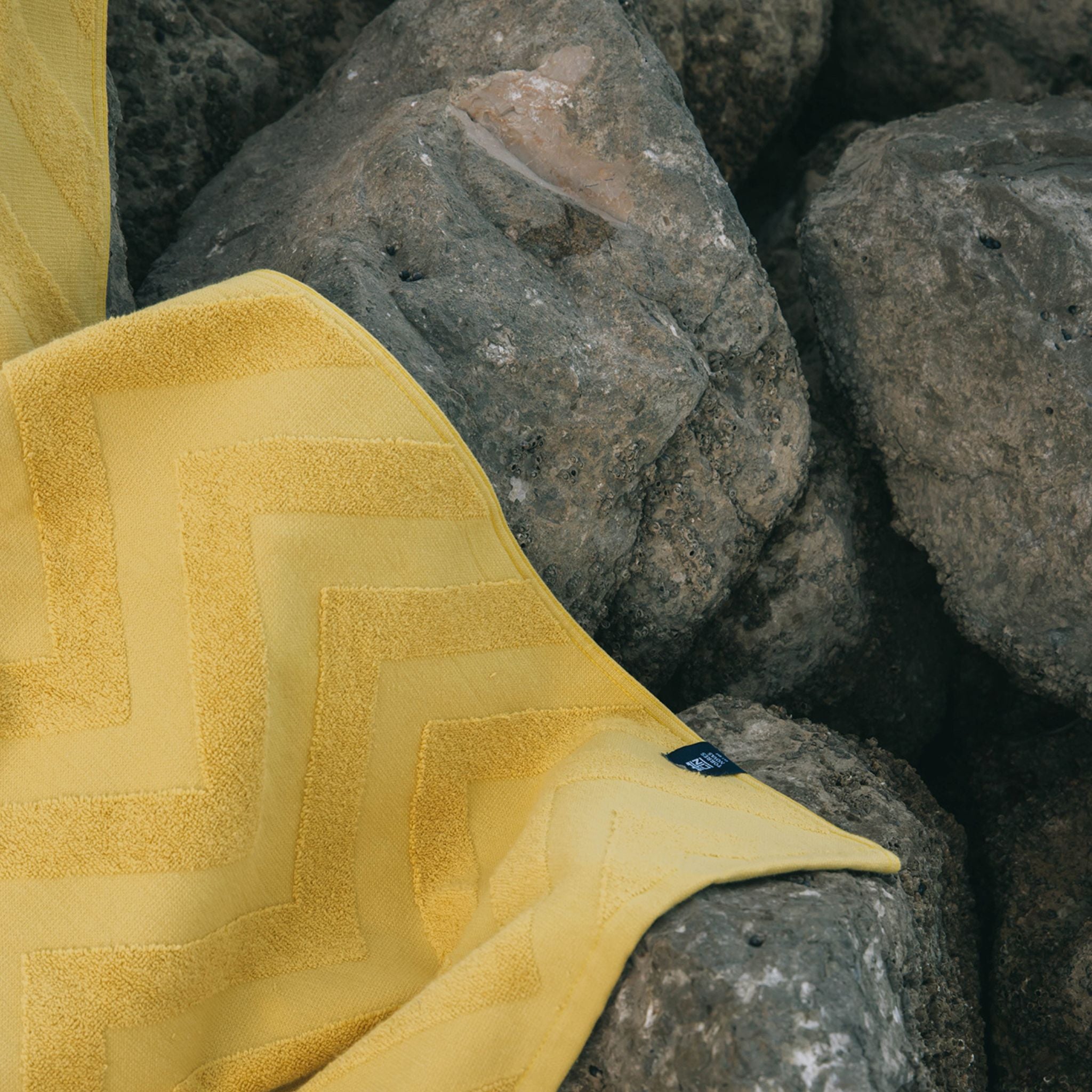 torres-novas-beach-mar-zigzag-towel-saffron-yellow-lifestyle-1.jpg