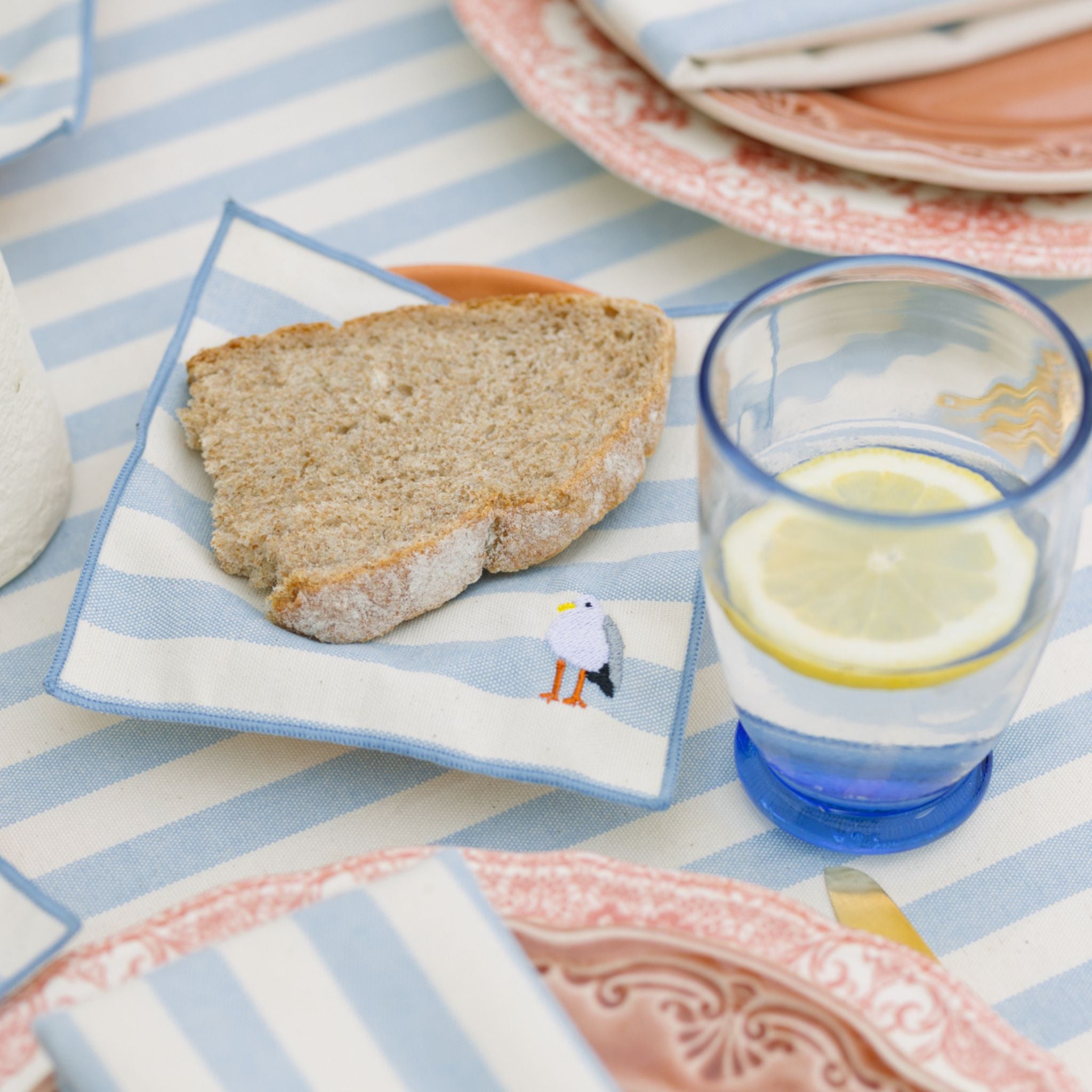 torres-novas-table-barra-embroidery-summer-cocktail-napkin-blue-sky-lifestyle-10.jpg