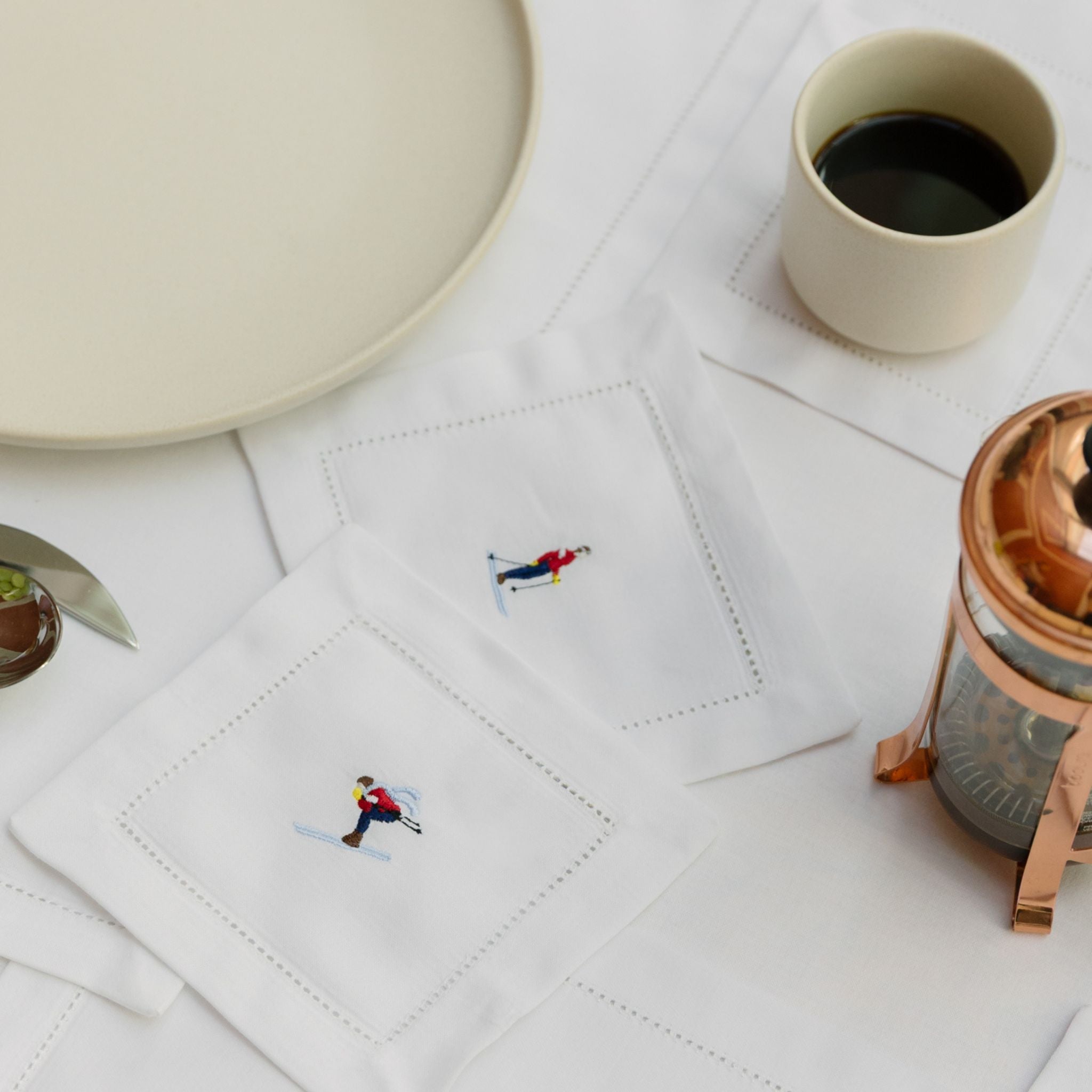 torres-novas-table-mafra-cotton-embroidery-retro-cocktail-napkin-skiers-lifestyle-2.jpg
