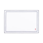 Mantelería Nazaré blanca, en algodón, con pequeños motivos de Navidad bordados.