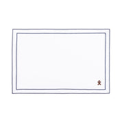 Mantelería Nazaré blanca, en algodón, con pequeños motivos de Navidad bordados.