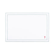 Mantelería Nazaré blanca, en algodón, con pequeños motivos de Navidad bordados.