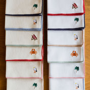 Mantelería Nazaré blanca, en algodón, con motivos de verano bordados