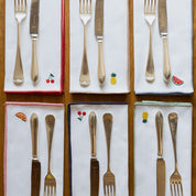 Mantelería Nazaré blanca, en algodón, con frutas bordadas